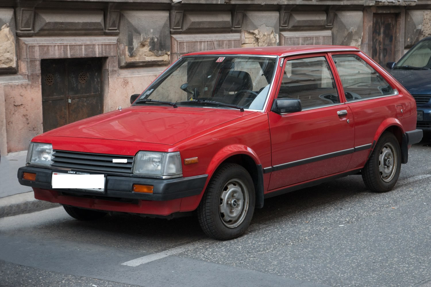 VIDRIO OPTICA MAZDA 323 II HATCHBACK IZQUIERDO